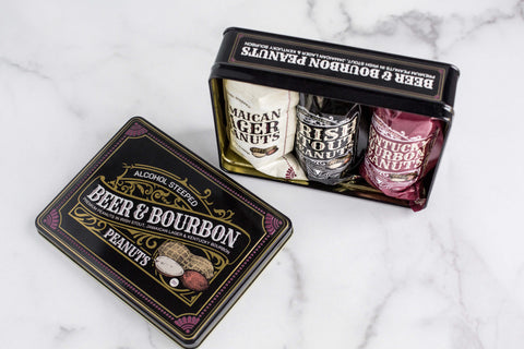 Beer & Bourbon Liquor Peanuts Tin with Jamaican Lager, Irish Stout, and Kentucky Bourbon flavors on marble background.