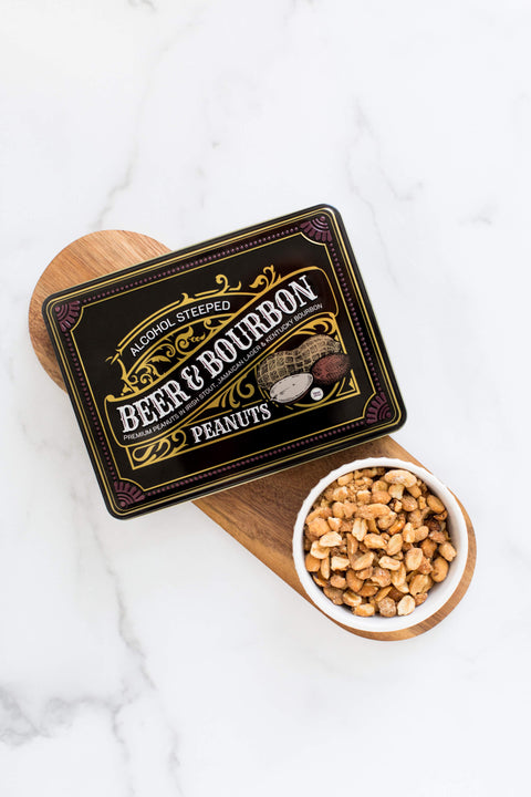 Gourmet Beer & Bourbon Liquor Peanuts Tin with roasted peanuts on wooden board.