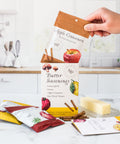 Butter seasonings spice pack in kitchen with Apple Cinnamon, Lemon Garlic, Umami Butter, and Sun-Dried Tomato flavors for cooking.