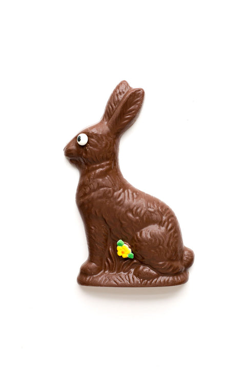 Premium handmade milk chocolate Easter bunny with decorative eye and flower, perfect for Easter baskets.