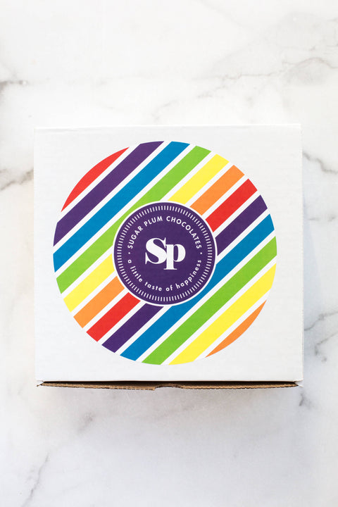 Happy Birthday Box with colorful striped design from Sugar Plum Chocolates for fun birthday treats.