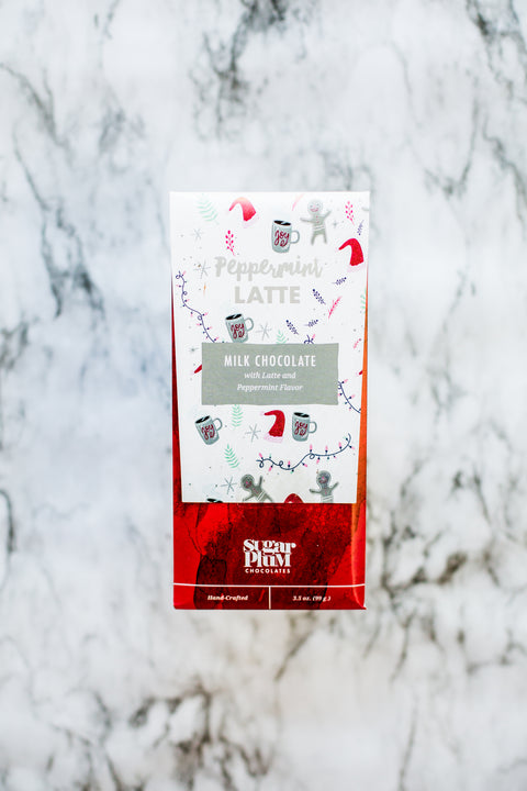 Peppermint Latte Chocolate Bar with festive packaging on marble background