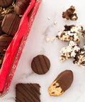 Chocolate Eruption Gourmet Gift Box with assorted hand-dipped treats, including cookies and popcorn, perfect for gifting or sharing.