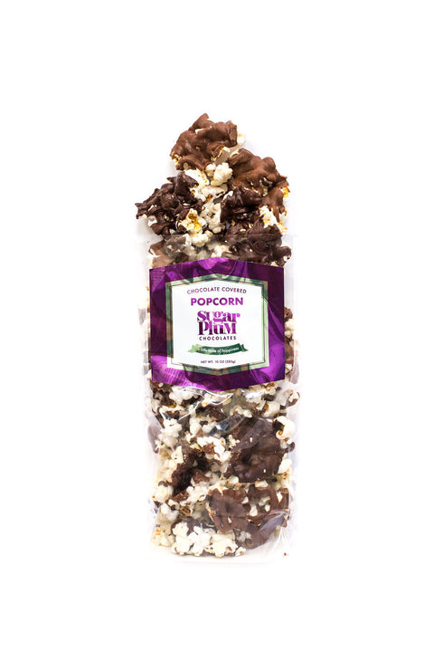 Chocolate-covered popcorn pack with gourmet milk and dark chocolate drizzle by Sugar Plum.