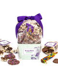 Gourmet chocolate gift basket with handcrafted treats by Sugar Plum, featuring chocolate-covered snacks, ideal for special occasions.