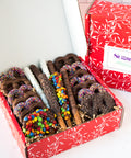 Chocolate Pretzel Passion Gift Box with assorted milk, dark, and white chocolate-covered pretzels topped with colorful candies.