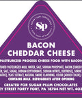 "Sugar Plum Bacon Cheddar Cheese label with ingredient list and branding details."