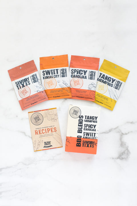 BBQ Blends 4 Flavor Spice Packets featuring savory, sweet, spicy, and tangy seasonings with recipe guide on marble surface.