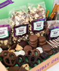 Gourmet chocolate assortment with pretzels, popcorn, and potato chips, hand-dipped in milk, dark, and white chocolates.