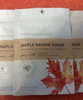 Five packs of Maple Brown Sugar Vegetable Seasoning with maple leaf design, perfect for enhancing roasted carrots and Brussels sprouts.
