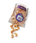 "Bag of salted cashews spilling out, part of The Comfort Box gourmet snacks care package"
