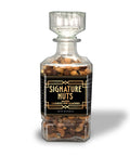 Premium salted cashews and almonds in elegant glass decanter for refined tastes, Damn Man Black Label.
