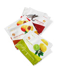 Assorted gourmet tea packets including peach oolong, vanilla rooibos, and citrus green, part of a comforting snack care package.