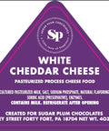 Sugar Plum Chocolates White Cheddar Cheese label with ingredients and storage instructions.