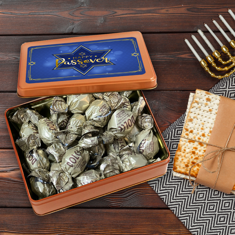 Kosher for Passover Pareve Dairy-Free Truffles in gift tin with matzah and menorah on wooden table.