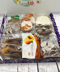 Get Well Soon Box with chocolate treats, cookies, pretzels, and teas for recovery and comfort