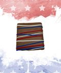 Patriotic chocolate square with red, white, and blue drizzle on an American flag-themed background.