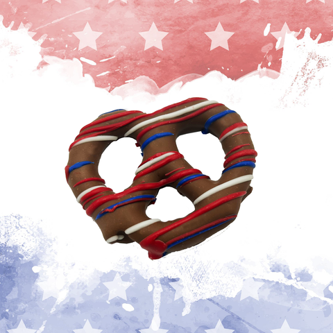 Chocolate pretzel with red, white, and blue drizzle on a patriotic background