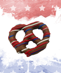 Chocolate pretzel with red, white, and blue drizzle on a patriotic background