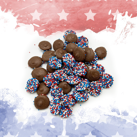 Patriotic chocolate candies with red, white, and blue sprinkles on a festive background for Independence Day and Veterans Day celebrations.