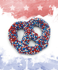 Festive red, white, and blue chocolate-covered pretzel with sprinkles on a patriotic background.