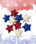 Patriotic chocolate stars in red, white, and blue on festive American flag backdrop for holiday celebrations.