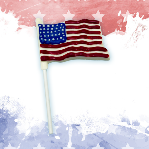 White chocolate American flag lollipop with stars and stripes on patriotic background