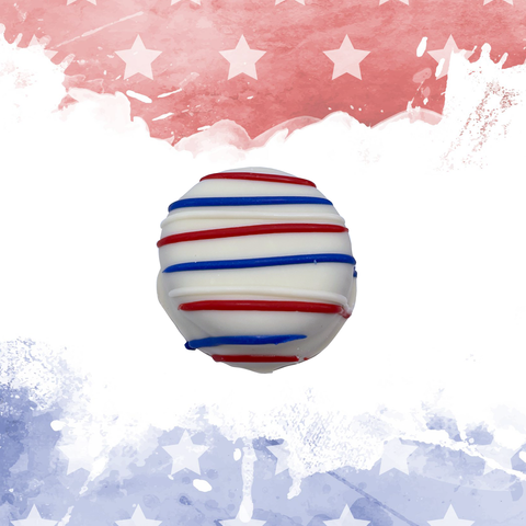 Red, white, and blue chocolate truffle with festive star-themed background.