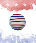Red, white, and blue chocolate truffle with festive star-themed background.