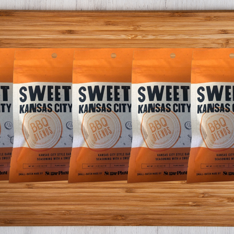 Sweet Kansas City BBQ Seasoning 5 Pack on wooden table, featuring handcrafted barbecue blend packaging.