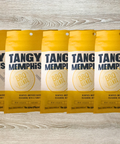 Five packs of Tangy Memphis BBQ Seasoning on a wooden surface, perfect for enhancing pork ribs and brisket with a sweet and spicy flavor.