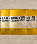 Five packs of Tangy Memphis BBQ Seasoning on a wooden surface, perfect for pork ribs, pulled pork, and brisket.