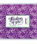 Decorative purple box with "Thinking of You" message, part of Sugar Plum’s Comfort Box - 15 Gourmet Snacks Care Package.
