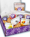 Gourmet snack care package with 15 sweet and salty treats in a purple box, perfect for sympathy or get-well gifts.