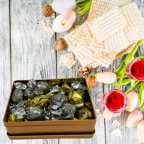 Kosher for Passover pareve dairy-free truffles in gift box with matzo and wine, perfect for holiday celebrations.