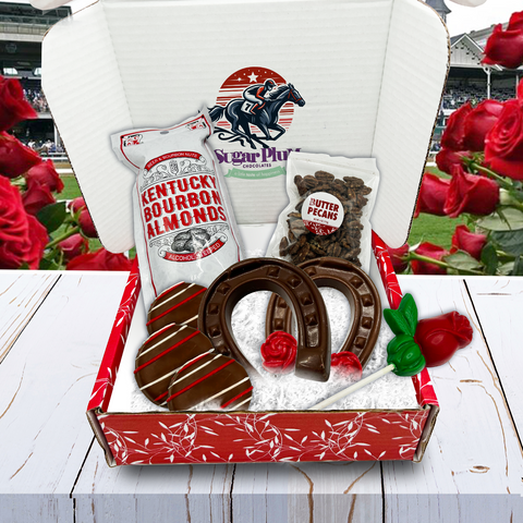 "Kentucky Derby Chocolate & Nuts Box featuring bourbon almonds, butter pecans, chocolate horseshoes, and rose lollipops."