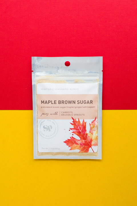 Maple Brown Sugar Vegetable Seasoning Pack with Fall Leaf Design on Red and Yellow Background