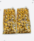 Two-pack of Sugar Plum's handcrafted caramel corn with white and milk chocolate drizzle in clear packaging.