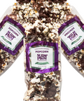Gourmet chocolate-covered popcorn 3-pack with milk and dark chocolate drizzle, Sugar Plum brand packaging.